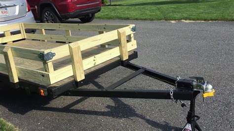 Keeps ladder within easy reach. . Harbor freight trailer side rails